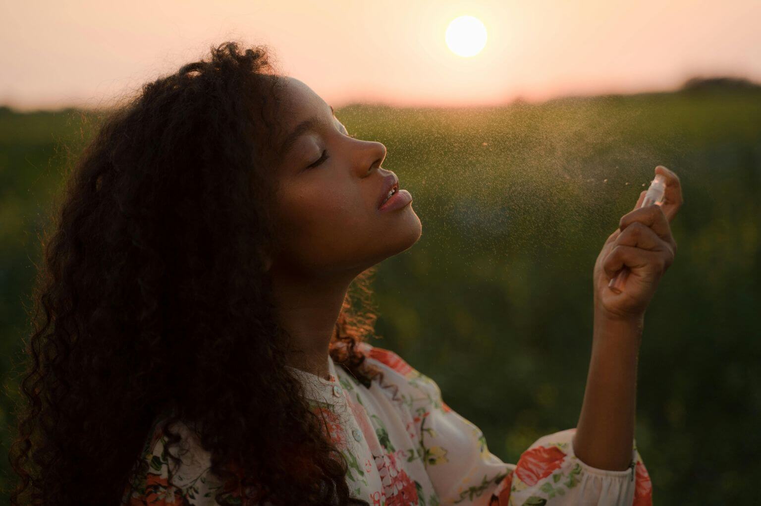 Picture of a woman spraying something in the air